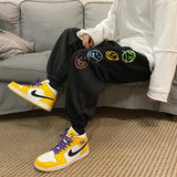 FOESCE Fashion Mens Vintage Washed Hip Hop Smile Face Printed Loose Fit Denim Pants Urban Style Trousers Male Sweatpants