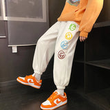 FOESCE Fashion Mens Vintage Washed Hip Hop Smile Face Printed Loose Fit Denim Pants Urban Style Trousers Male Sweatpants