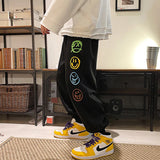 FOESCE Fashion Mens Vintage Washed Hip Hop Smile Face Printed Loose Fit Denim Pants Urban Style Trousers Male Sweatpants