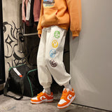 FOESCE Fashion Mens Vintage Washed Hip Hop Smile Face Printed Loose Fit Denim Pants Urban Style Trousers Male Sweatpants