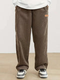 Autumn and winter men's corduroy casual pants with leather label decoration, solid color pockets, straight leg pants suitable fo